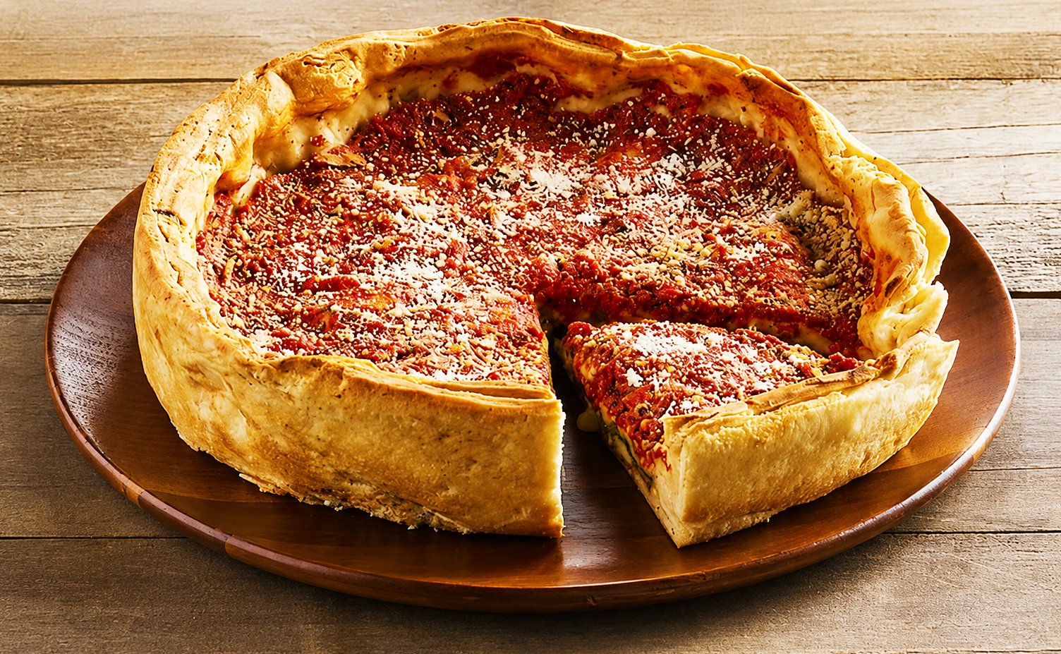 Deep dish pizza with a tall crust wall